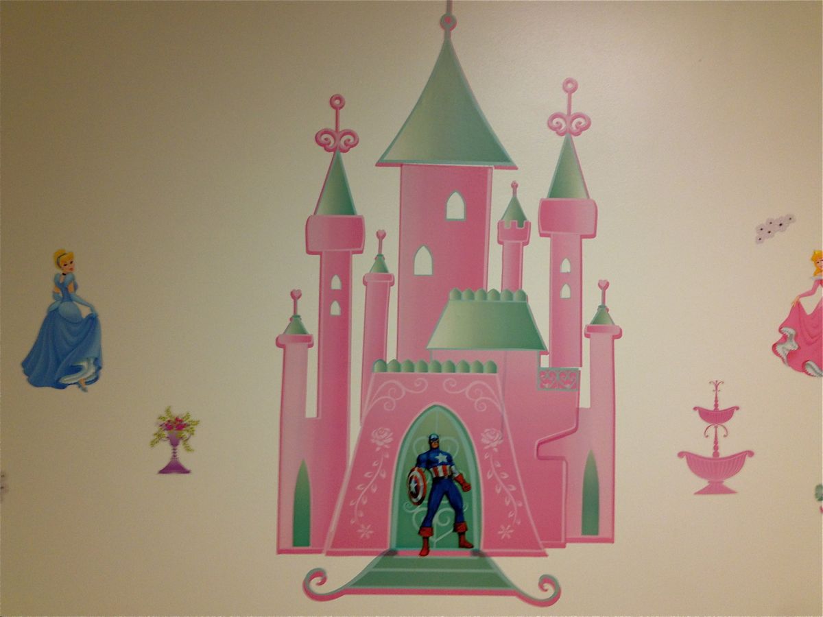 A Captain America home decor sticker placed on a Disney Princess home decor sticker. 
