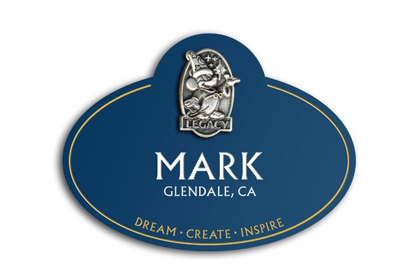 The name tag emphasizes the idea that the individual has worked to help dream, create, and inspire others.